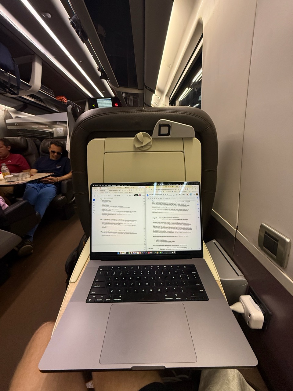 Working on a laptop aboard a high-speed train